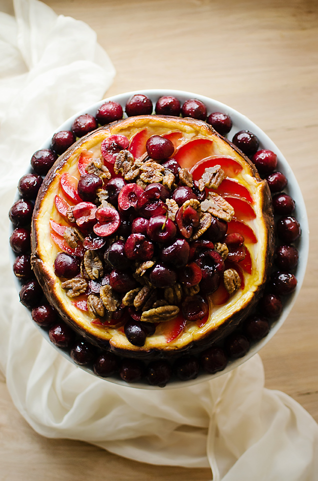 Stone Fruit Triple-Cheesecake: savory brie and goat cheese cheesecake on a rosemary rice cracker crust, topped with glazed fruit and candied pecans